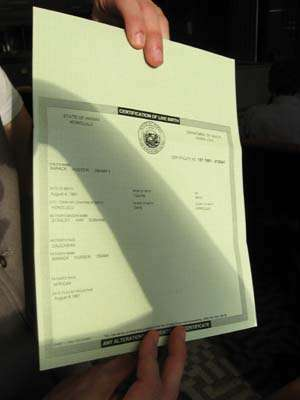 The Obama birth certificate, held by FactCheck.org writer Joe Miller in 2008.